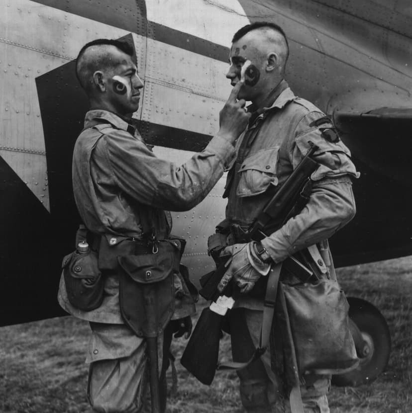 Soldier applying war paint before D-Day